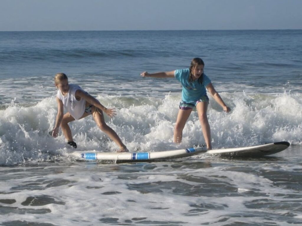 Kokopelli - kids surfing