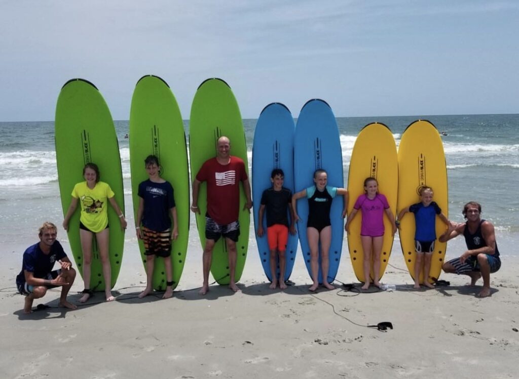 Kids with surfboards - Kokopelli
