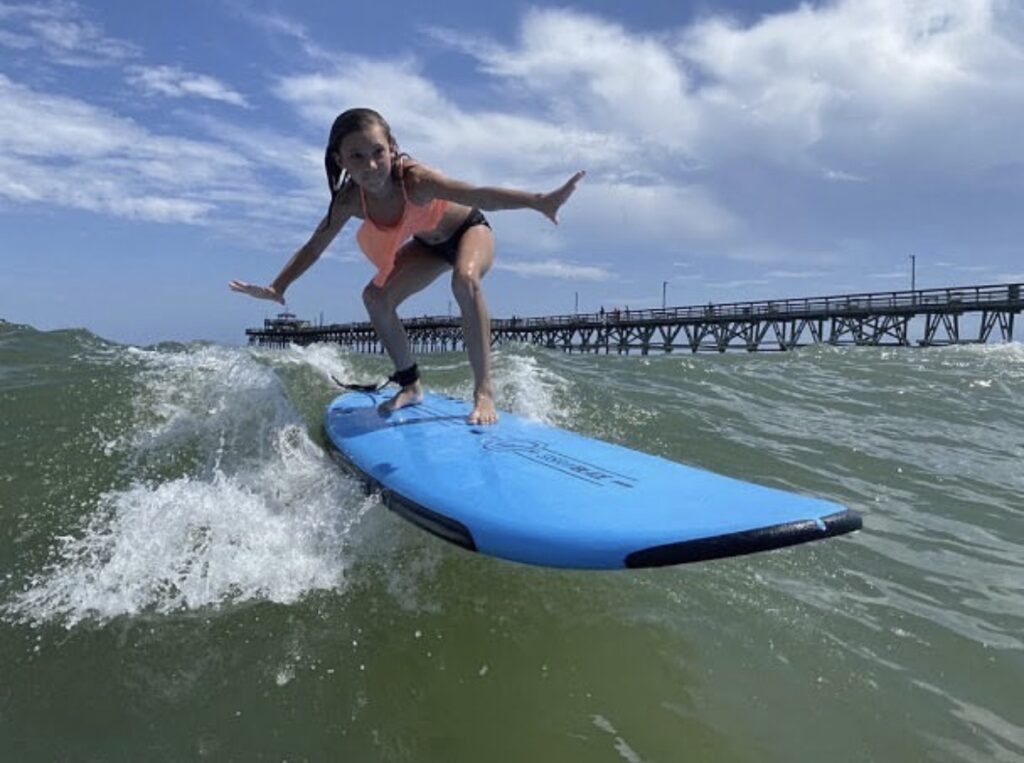 little girl surfing - Kokopelli surfing
